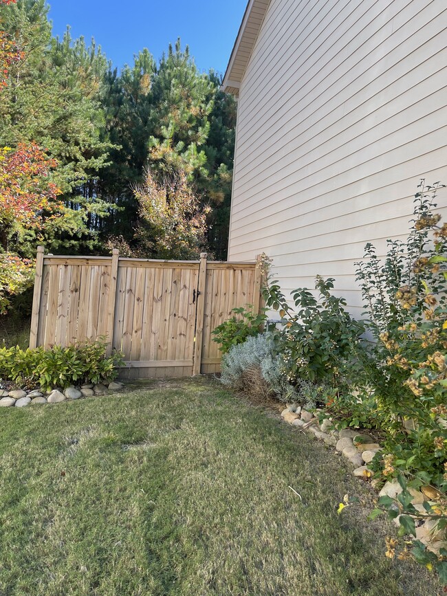 Fence to backyard from front - 6505 Muirfield Pt