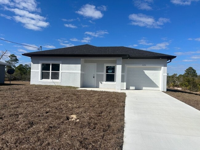 Building Photo - Brand-New Modern 2BR/2BA Home with Garage- In Serene Lake Placid Location