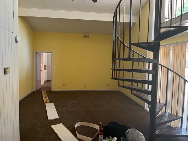 In Den area is a sporran staircase to the upstairs - 242 Hollyvale Dr