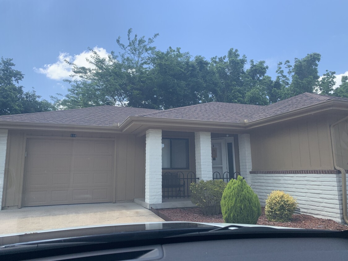 Front of condo, private garage, extra parking area - 614 Cooper Estates Dr