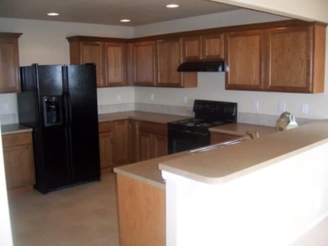 Building Photo - Wonderful two level home with an unfinishe...