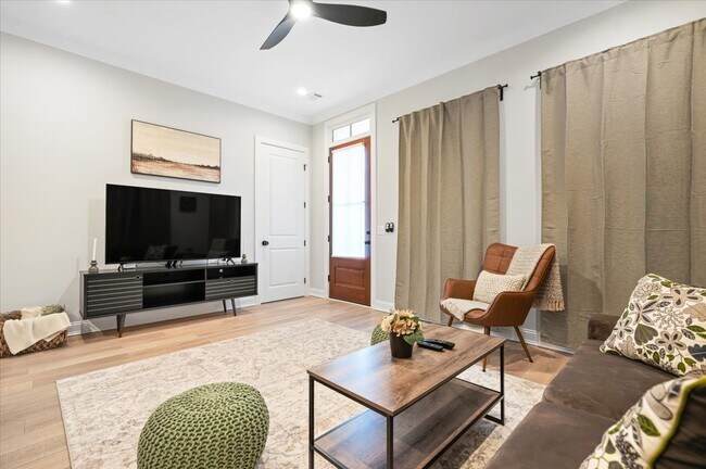 Living room with 65" LG smart TV - 203 W Anderson St