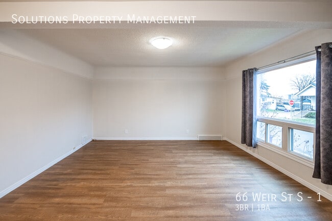 Building Photo - **Newly Renovated 3 Bedroom Main Floor Unit**