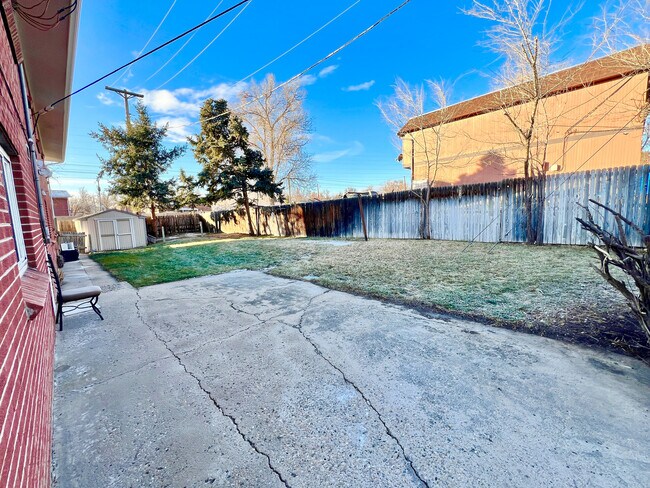 Experience relaxation in this expansive backyard retreat, perfect for family gatherings and leisure. - 1301 Ammons Street