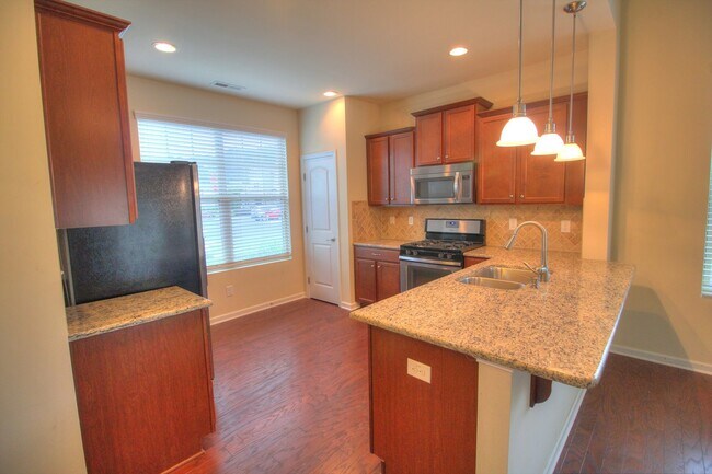 Photo - End Unit Townhome with Screened Porch & Fenced Yard!