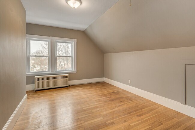 Spacious main bedroom with large windows and closet. - 5 Larchmont Rd
