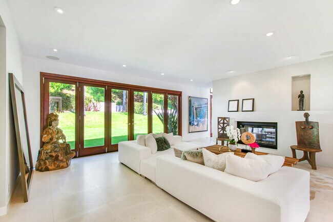 Living room opens to backyard - 1290 San Ysidro Dr