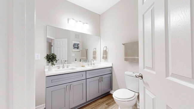 Renovated Bathrooms with New Vanities, Countertops, and Lighting - Creekside at White Oak