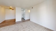 Located at 3535 Marconi Ave in Sacramento, California, this two-bedroom, one-bathroom residence offers a well-organized single-floor layout thoughtfully designed to maximize functionality. The living room serves as the heart of the home, featuring plush neutral carpeting, a textured ceiling, and a large sliding glass door that opens directly onto a private balcony, filling the space with natural light and outdoor views. Adjacent to the living room, the dining area flows seamlessly into the kitchen, which is equipped with white cabinetry, standard appliances, and wood-look vinyl flooring. A hallway connects the main living spaces to the private quarters, where two carpeted bedrooms await. The spacious primary bedroom includes a closet and a window fitted with vertical blinds for light control. The second bedroom also features a window with vertical blinds, a closet with sliding doors, and soft carpeting. A full bathroom serves both bedrooms, complete with a tiled tub-shower combination, wood-look vinyl flooring, and a vanity with a speckled countertop. Throughout the home, a consistent neutral color palette, HVAC venting, and clean white trim contribute to a bright, move-in-ready atmosphere.