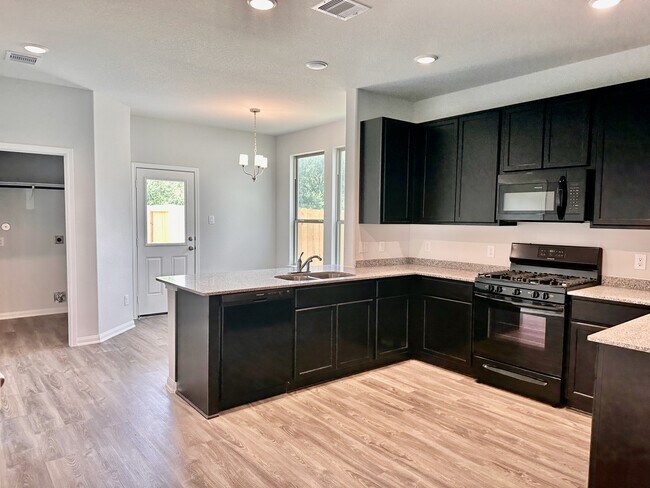 The sparkling kitchen awaits you with plenty of storage and a gas range! - 730 Tejas Village Pky