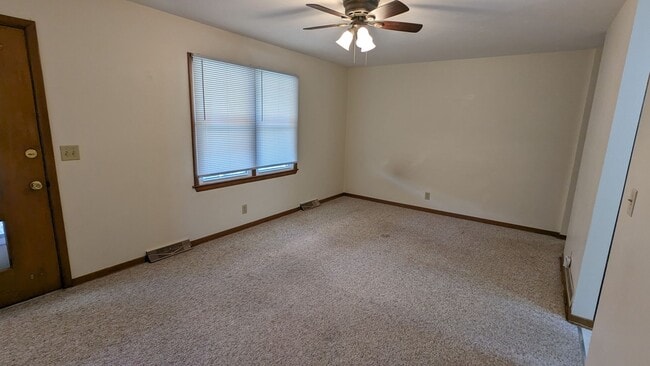 Building Photo - West end duplex with fenced yard