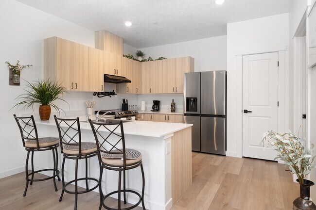 2 habitaciones, 1.5 baños - 1,060 pies cuadrados - Cocina - Autumn Leaf Apartments 55+ Community