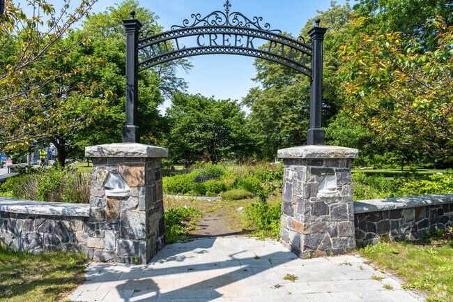 Mill Creek Park greets visitors with its signature iron arch entrance.