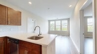 This contemporary 1030 square foot home at 751 Vandenberg Road offers a well-designed living space with two bedrooms and two bathrooms. The open-concept layout seamlessly connects the kitchen and living areas, creating an inviting atmosphere for both relaxation and entertainment.

The kitchen boasts warm wood cabinetry, sleek stainless steel appliances, and a stylish subway tile backsplash. The living room features ample natural light and durable wood-look flooring that extends throughout the home, providing a cohesive and modern aesthetic.

Both bathrooms are equipped with quality fixtures, including a glass-enclosed shower in one and a vanity with ample storage in the other. The primary bedroom, measuring 200 square feet, offers a spacious retreat with large windows that flood the room with natural light.

Additional amenities include in-unit laundry facilities and well-designed closet spaces for optimal storage. The neutral color palette and clean lines throughout the home create a canvas for personalization while maintaining a contemporary feel.

This single-story residence combines functionality with style, making it an ideal space for modern living. Its thoughtful design maximizes the use of space, ensuring comfort and convenience in every corner of the home.