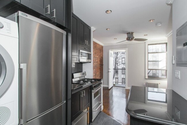 Photo - 309 E 8th St Apartment