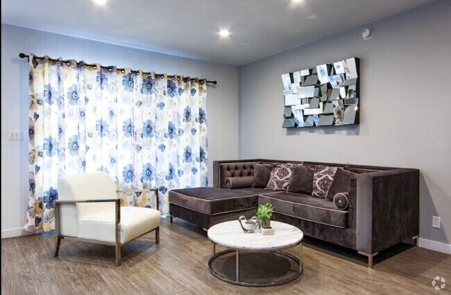 Living Room with Double paned balcony doors - The Runyon