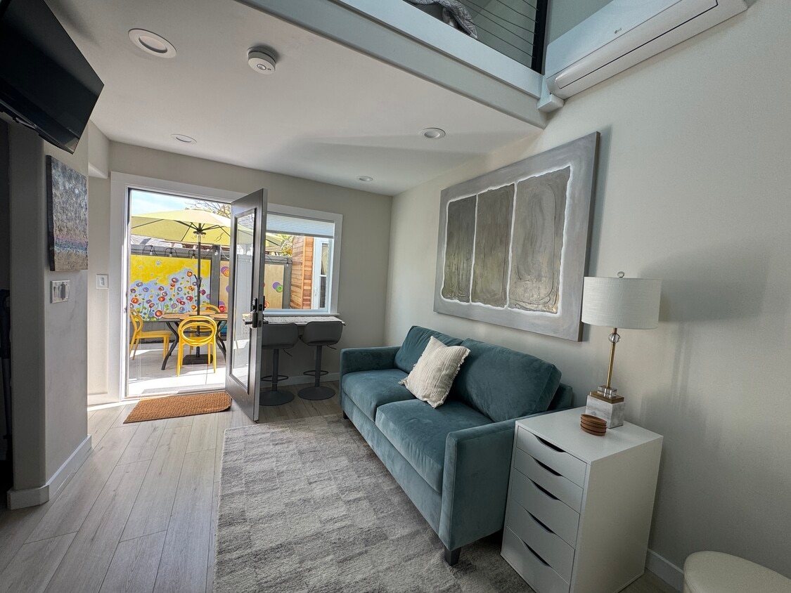 Open concept living room with view to private yard - 3744 Granada Ave