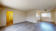Located at 4070 Ursula Ave in the Baldwin Hills neighborhood of Los Angeles, this one-bedroom, one-bathroom unit offers a practical and well-organized layout across a single floor. Light-toned laminate wood flooring runs throughout the entire space, lending a clean, cohesive look to every room.

The open living area is bright and inviting, featuring textured ceilings, neutral cream-toned walls, and large windows with vertical blinds that allow generous natural light. A front entry door opens directly to the living space, which flows into a dedicated dining area equipped with a ceiling fan.

The kitchen is efficiently designed with cream cabinetry, a tile backsplash, ample counter space, and white appliances including a range and refrigerator. A window above the sink brings in additional natural light, enhancing the overall brightness of the cooking space.

The bedroom is comfortably sized, featuring a wide window with views of surrounding greenery and access to a dedicated closet with built-in shelving. The bathroom features a full bathtub with tiled surround, a vanity, and laminate flooring consistent with the rest of the unit.

Overall, this unit offers a bright, functional living environment with consistent finishes throughout, ideally situated in Los Angeles.