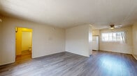 Located at 4070 Ursula Ave in the Baldwin Hills neighborhood of Los Angeles, this one-bedroom, one-bathroom unit offers a practical and well-organized layout across a single floor. Light-toned laminate wood flooring runs throughout the entire space, lending a clean, cohesive look to every room.

The open living area is bright and inviting, featuring textured ceilings, neutral cream-toned walls, and large windows with vertical blinds that allow generous natural light. A front entry door opens directly to the living space, which flows into a dedicated dining area equipped with a ceiling fan.

The kitchen is efficiently designed with cream cabinetry, a tile backsplash, ample counter space, and white appliances including a range and refrigerator. A window above the sink brings in additional natural light, enhancing the overall brightness of the cooking space.

The bedroom is comfortably sized, featuring a wide window with views of surrounding greenery and access to a dedicated closet with built-in shelving. The bathroom features a full bathtub with tiled surround, a vanity, and laminate flooring consistent with the rest of the unit.

Overall, this unit offers a bright, functional living environment with consistent finishes throughout, ideally situated in Los Angeles.