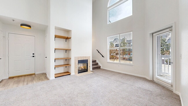 Living Room with fireplace, stairs to loft - 6021 Castlegate Dr W
