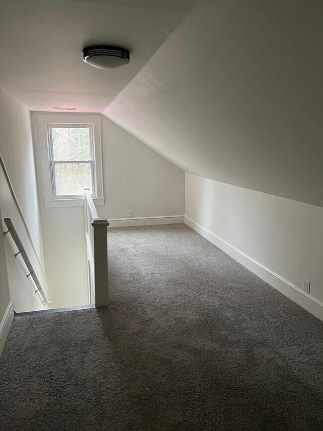 Lofted living room with brand new carpet - 3600 S Main St