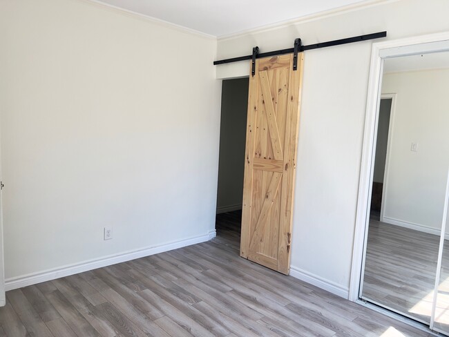 Bedroom #2 (features barn door to small "hallway" that leads to second bathroom - 4874 W 23rd St