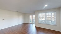 Located at 2100 Hana Road in Edison, NJ, this well-appointed 2-bedroom, 2-bathroom residence offers a thoughtfully designed single-floor layout with generous living space. Rich hardwood-style flooring flows throughout, complementing the clean, neutral palette of crisp white walls and textured ceilings.

The open-concept living, dining, and kitchen area forms the heart of the home. Sliding glass doors invite natural light and provide direct access to a private patio with outdoor views. The kitchen is equipped with granite-style countertops, white cabinetry, black appliances including a gas range, microwave, dishwasher, and refrigerator, along with a window that adds brightness to the space.

The spacious primary bedroom features two windows for ample natural light and includes a generous walk-in closet with built-in shelving. The secondary bedroom is equally well-lit. Both bathrooms are clean and functional; one features a walk-in shower with sliding glass doors, mosaic tile flooring, a single-sink vanity, and tiled walls. Storage is plentiful throughout, with four closets in total. A dedicated laundry area adds everyday convenience, rounding out this practical and comfortable residence in Edison, NJ.