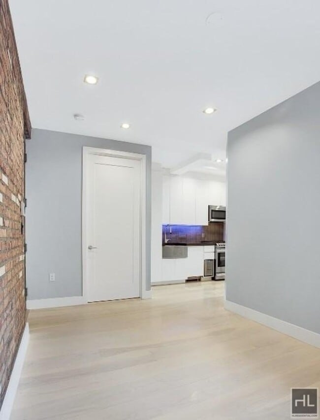 Building Photo - Renovated Lower East Side 1-Bedroom with M...