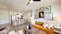 Located at 200 Aycock Avenue in Monroe, GA, this 2-bedroom, 2-bathroom residence offers a thoughtfully designed single-floor open-concept layout. The kitchen is a standout feature, showcasing crisp white shaker cabinetry, granite countertops, a subway tile backsplash, stainless steel appliances, and a spacious island with bar seating illuminated by sleek pendant lights — ideal for both cooking and casual dining. The kitchen flows seamlessly into the living area, which features wood-look flooring, a ceiling fan, large windows, and a glass door that invites abundant natural light and outdoor views. The primary bedroom is generously sized, with windows on two walls, a ceiling fan, and direct access to an en-suite bathroom complete with granite vanity countertops and white cabinetry. The second bedroom is equally well-lit and comfortable, with its own access to a full bathroom. Both bathrooms mirror the kitchen's refined aesthetic with granite counters and white finishes. Two closets provide ample storage throughout. The overall ambiance is bright, clean, and modern, with warm wood-tone flooring and neutral walls creating a welcoming and versatile living environment.