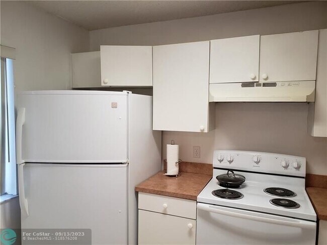 Building Photo - 8550 N Sherman Cir