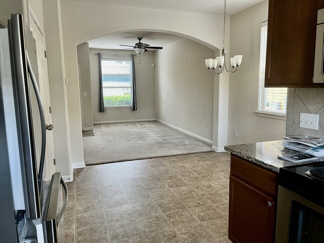 From kitchen looking through dining room into living room - 5424 Falling Leaf Ln