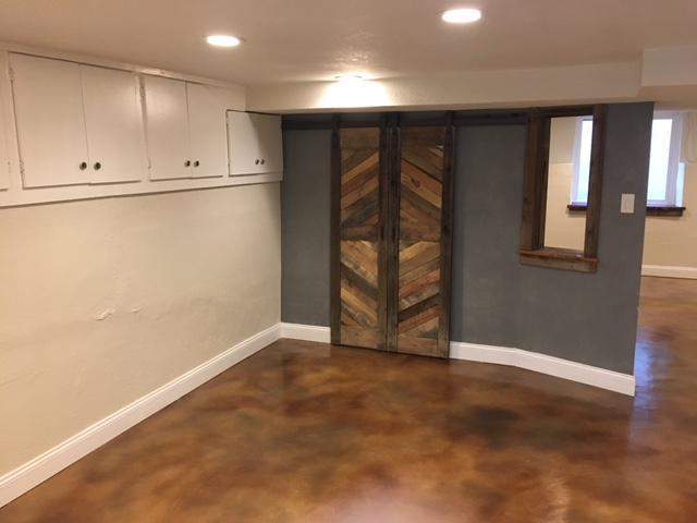 Eat in Kitchen with loads of storage and reclaimed barn doors on pantry/coat closet. Brand new STAINED CONCRETE FLOORS, wood baseboards, and LED recessed lighting throughout. - 2261 Newark st