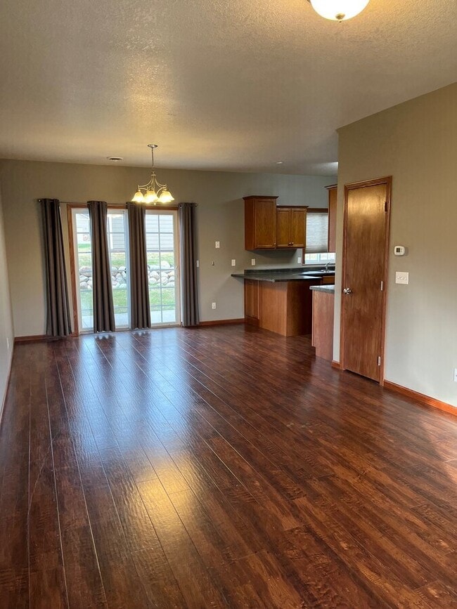 Spacious Living Room with abundant light, beautiful flooring, and open design. - 1501 N Grove Pl