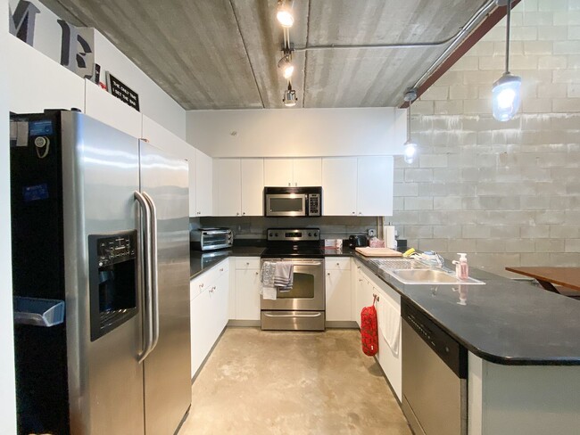 Building Photo - Pet Friendly! Lofts Oasis #105