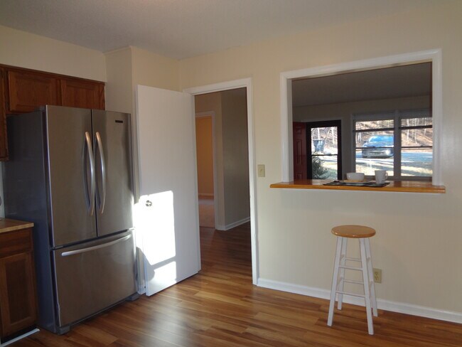 Kitchen to breakfast bar and living room - 221 Cedar Terrace Rd