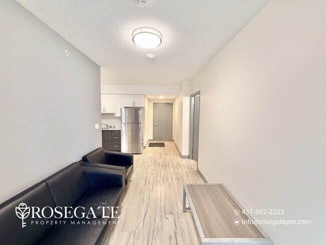 Photo du bâtiment - Modern 2-Bedroom Condo with Balcony in the...