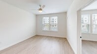 Located at 5151 Patriarch Place North in North Augusta, SC, this well-appointed one-bedroom, one-bathroom residence offers a thoughtfully designed layout across a single floor. Light hardwood-style flooring runs throughout the space, creating a cohesive and clean aesthetic.

The kitchen is a standout feature, outfitted with crisp white shaker cabinetry, a subway tile backsplash, quartz countertops, and a full suite of stainless steel appliances including a French door refrigerator, electric range, built-in microwave, and dishwasher. Pendant lighting above the peninsula adds a modern touch, while recessed lighting brightens the entire area.

The living space flows naturally from the kitchen, offering an open and functional arrangement. The bedroom is a comfortable size, featuring a ceiling fan with light fixture, blinds-covered windows that allow ample natural light, and views of the surrounding community.

The bathroom is well-designed with a white vanity featuring black hardware accents, a single undermount sink, quartz countertop, and a tiled tub-shower combination. Wood-look flooring and recessed lighting complete the clean, contemporary look.

A dedicated closet provides practical storage. The unit's neutral palette and modern finishes create a bright, inviting atmosphere throughout.