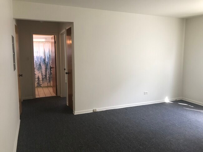 Hallway to bedrooms and bathroom. - 8616 47th St