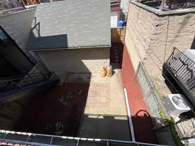Back patio trimmed, landscaped. - 1318 W Grenshaw St