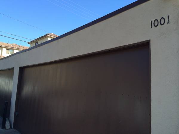 Garage with an access door to the backyard - 1001 S Tamarack Dr