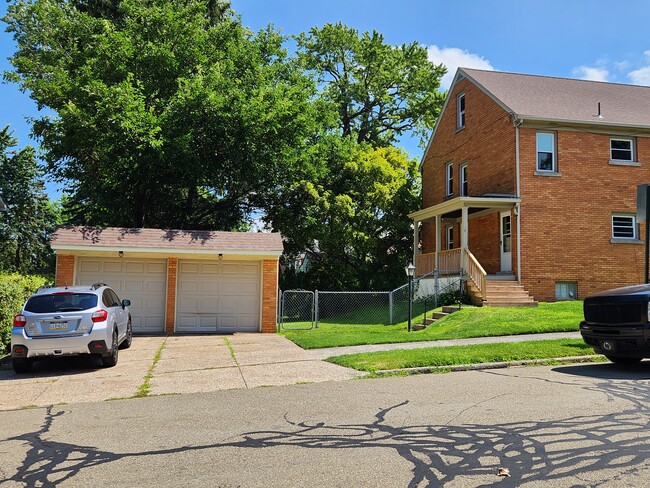 Rear entrance, porch, garage - 102 E 38th St