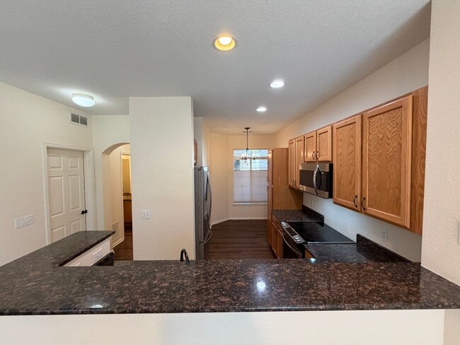 Building Photo - Immaculate Townhome Near Southlands with Granite Kitchen, Fireplace & Two Primary Suites