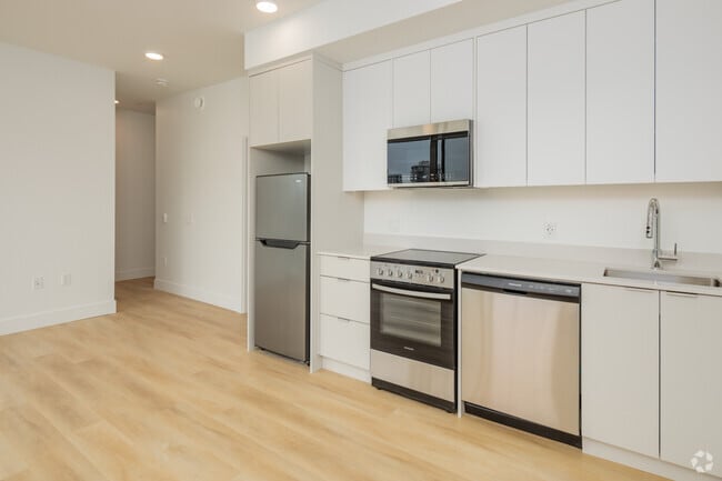 2 chambres, 2 salles de bain - 702 pi2 - Cuisine - Raven Apartments