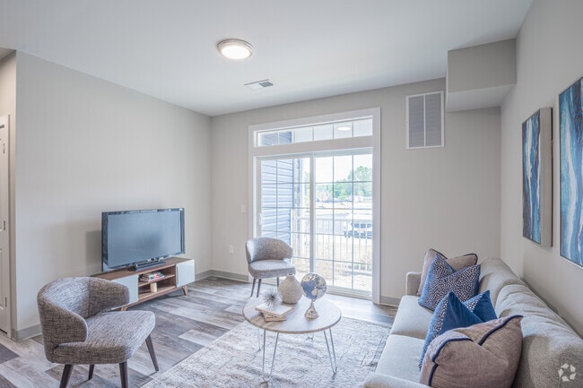 2 BR, 2 BA - 980 SF - Living Room - Main Road Apartments