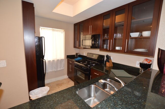 Building Photo - Meridian STUDIO Condo Fully Furnished w/Main Pool View-Lush Green trees in Resort Style Community.