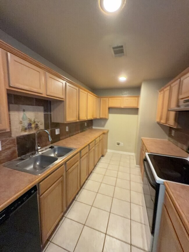 Building Photo - 3/2/2 features an open and inviting living and dining area, updated wood-look flooring, and a spa...