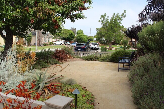 2.Front of House with Bench to enjoy the quiet neighborhood - 7836 Kenyon Ave