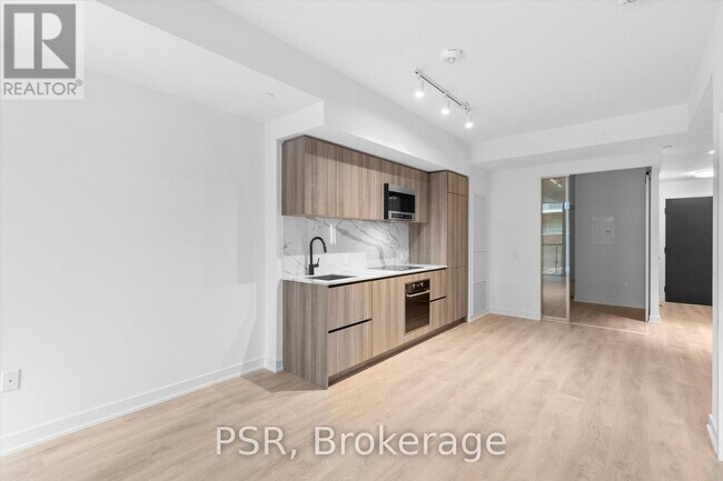 Photo du bâtiment - 117-117 Broadway Ave
