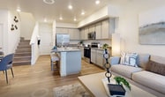 This contemporary residence at 1438 N Altura Blvd, Aurora CO 80011, offers 1360 square feet of thoughtfully designed living space across two floors. The home boasts three bedrooms and three bathrooms, with the primary bedroom measuring a generous 180 square feet. The ground floor spans 510 square feet, while the upper level extends to 850 square feet.

The interior showcases a modern aesthetic with clean lines and a neutral color palette. Wood-look flooring runs throughout, adding warmth and continuity. The open-concept living area seamlessly combines the kitchen and living room, ideal for entertaining. The kitchen features sleek gray cabinetry, granite countertops, and stainless steel appliances.

Bathrooms are designed with functionality and style in mind, incorporating pedestal sinks, modern fixtures, and glass-enclosed showers. The dedicated laundry room is equipped with full-sized washer and dryer units. Bedrooms are bright and spacious, with ample natural light streaming through large windows.

Storage solutions include walk-in closets and built-in shelving. The home's decor is minimalist yet inviting, with tasteful artwork and contemporary furnishings complementing the space. Overall, this property offers a perfect blend of modern design and practical living in a desirable Aurora location.