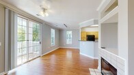 Located at 105 King Farm Blvd in Rockville, MD, this well-appointed single-floor home offers three bedrooms, three bathrooms, and a thoughtfully designed layout. The open-concept living and dining area is a standout, featuring warm hardwood flooring, crown molding, a ceiling fan, and a tile-surround fireplace. Large sliding glass doors flood the space with natural light and provide direct access to a private outdoor balcony. The kitchen is open to the living area and is equipped with light wood cabinetry, dark granite-style countertops, black appliances including a gas range, microwave, refrigerator, and dishwasher, and easy-care tile flooring. The three bedrooms are carpeted for comfort, each with ceiling fans and neutral wall tones. The primary bedroom is a generous size, complete with a closet and private bathroom access. The additional bedrooms offer ample space and natural light through well-placed windows. The three bathrooms are clean and functional, each featuring wood-toned vanities, tile flooring, and tub-shower combinations with white tile surrounds. Two closets provide convenient storage throughout the home. The overall ambiance is bright, neutral, and move-in ready.